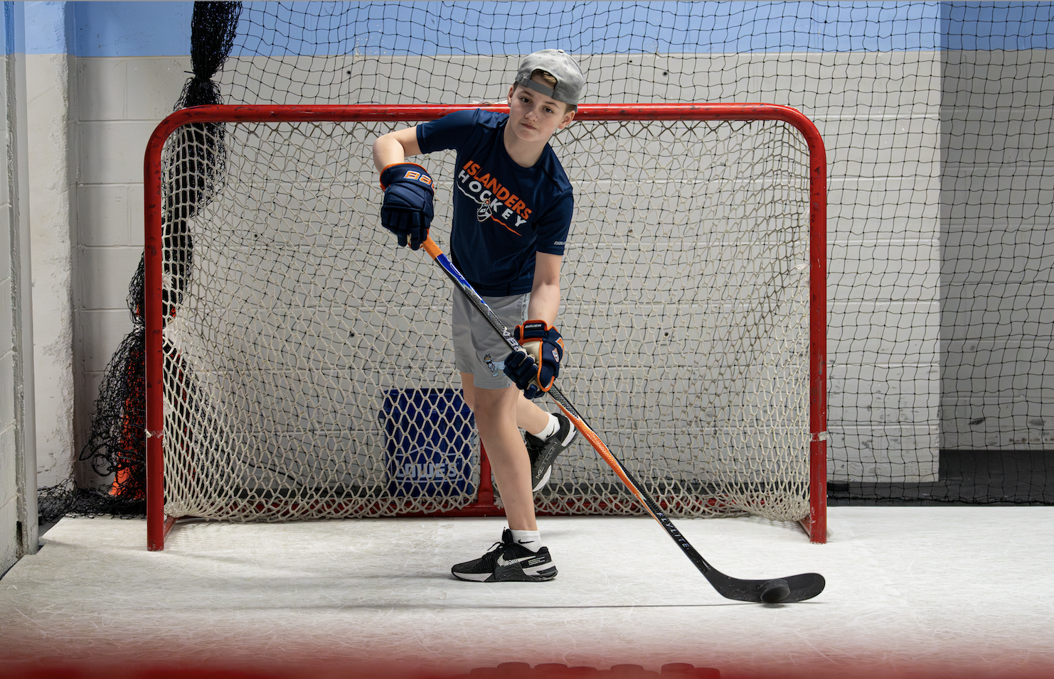 Coach on the synthetic ice training surface
